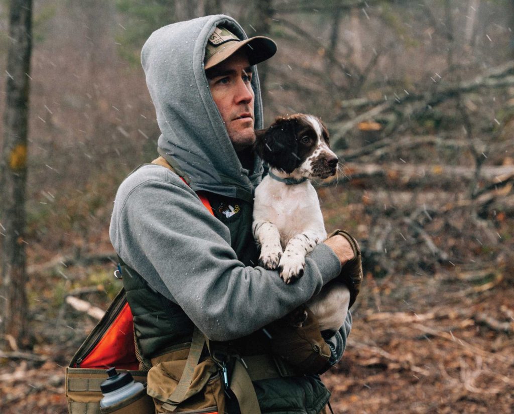 A man with a Springer Spaniel