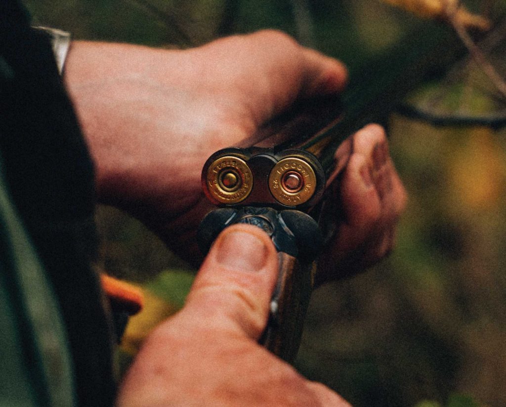 a sub-gauge grouse gun out in the woods