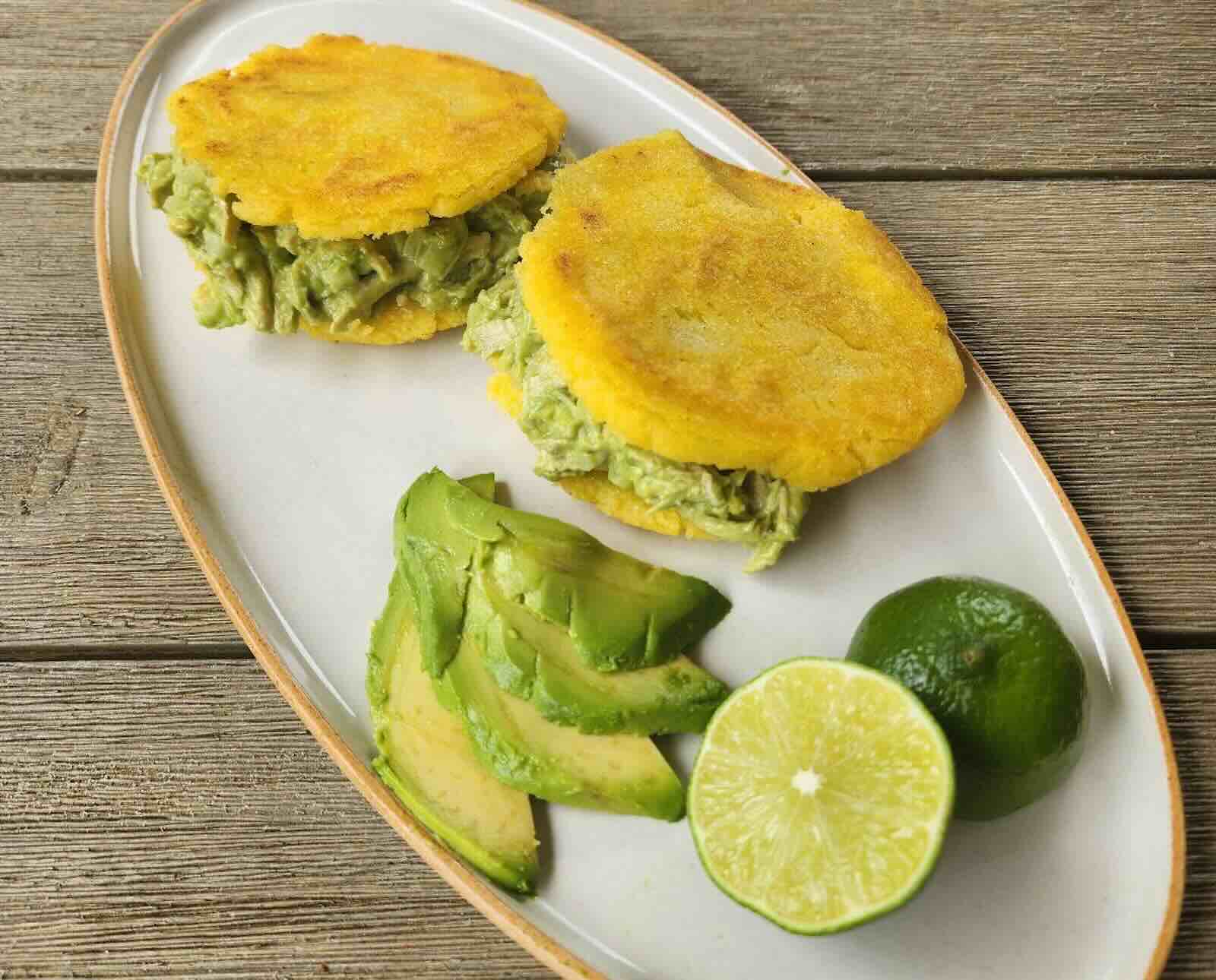 Reina pepiada made with chukar and stuffed into fried dough arepas