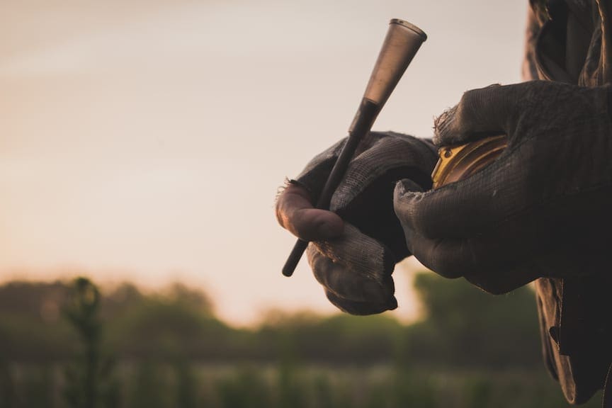 A turkey hunter holds a slate call