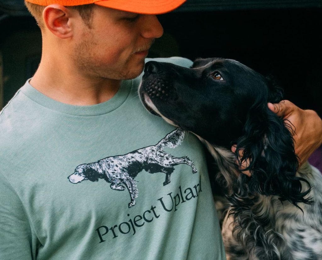 An English Setter beinf friendly with its owner