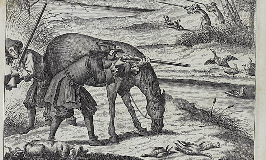 A hunter hides behind a stalking horse while a retriever waits patiently at his feet