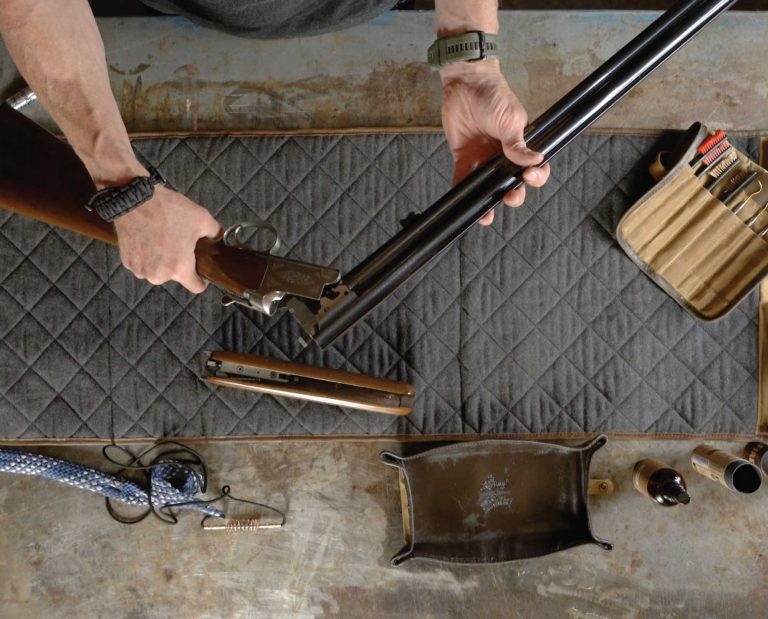 Fred Bohm of Sage & Braker cleans an over/under shotgun