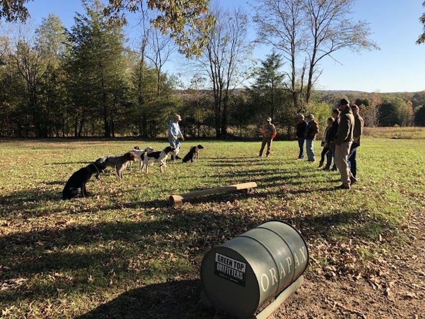 A group of dog handlers listens at a Rick Smith dog training seminar