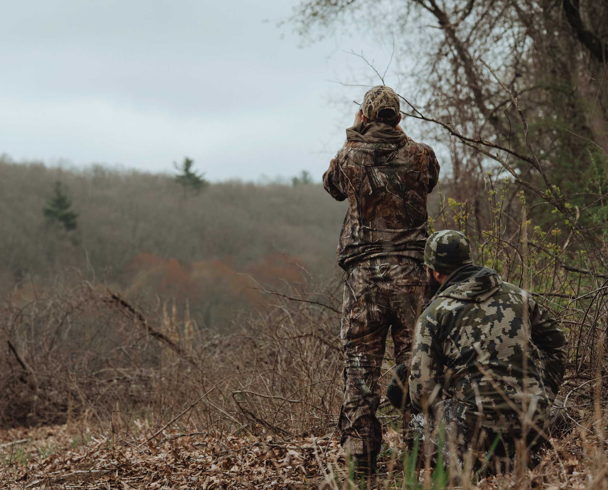 Two turkey hunters using the turkey fanning tactic