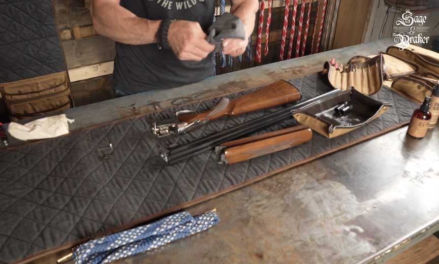 Wiping down metal parts of shogun with cloth  