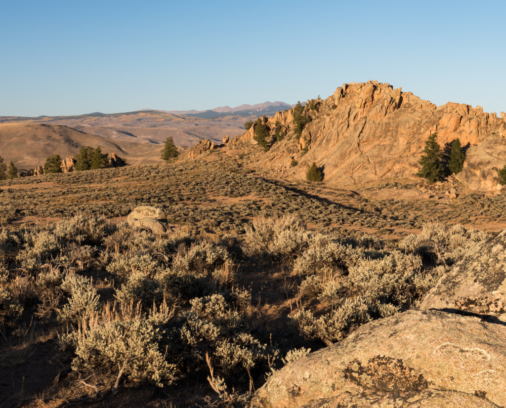 A rocky, sagebrush-filled scene from Hartman Rocks Recreation Area in Colorado.