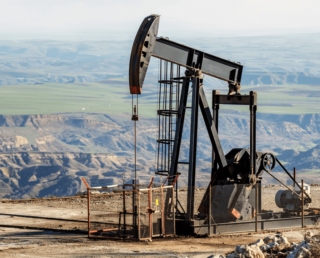 An oil rig in the mountains.