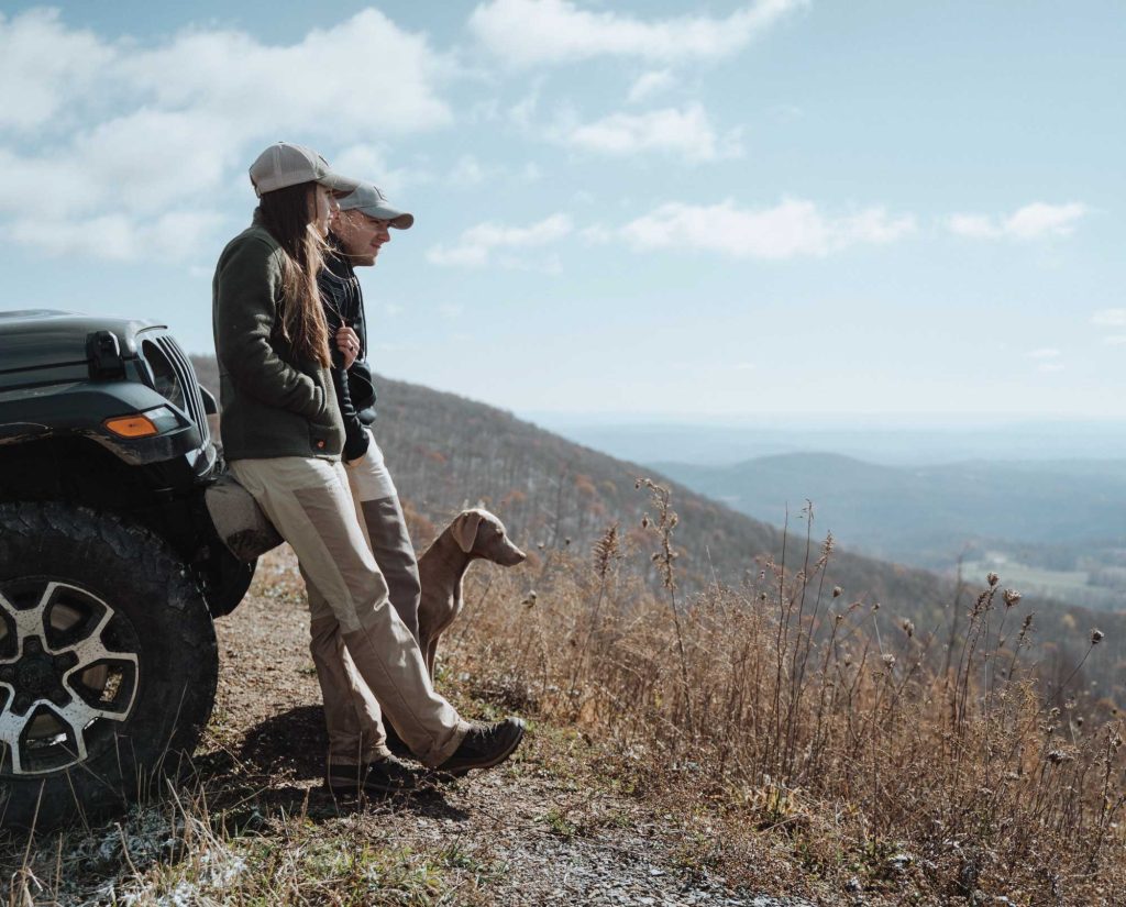 The Ballengee family looks at the valley below while hunting