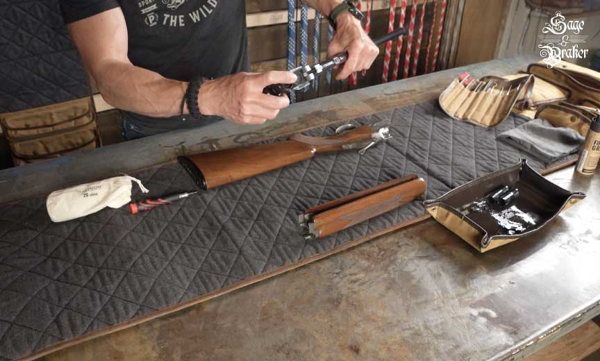 Spraying a shotgun cleaner down both barrels