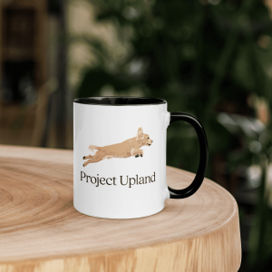 An English Cocker coffee mug on a table being used.